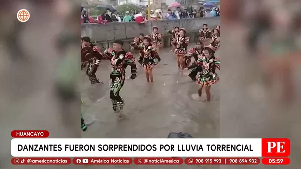 Danzantes fueron sorprendidos por lluvia torrencial en Huancayo. Foto: América Noticias