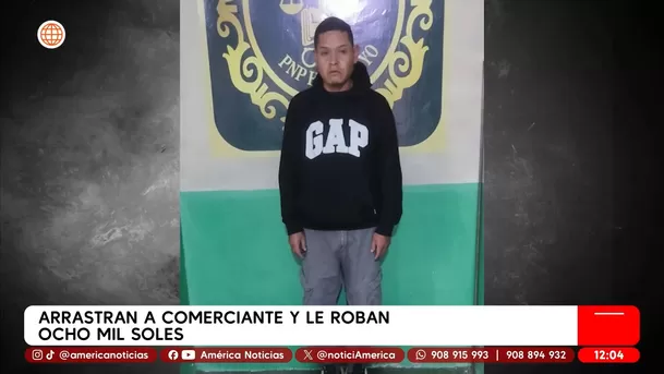Delincuente arrastra a comerciante para robarle 8 mil soles. Foto y video: América TV