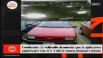 SAT asegura que vehículo infractor color negro es igual al del agraviado de color rojo.  