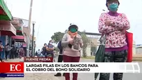 Largas colas en bancos para cobro de bono.