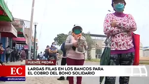 Largas colas en bancos para cobro de bono.