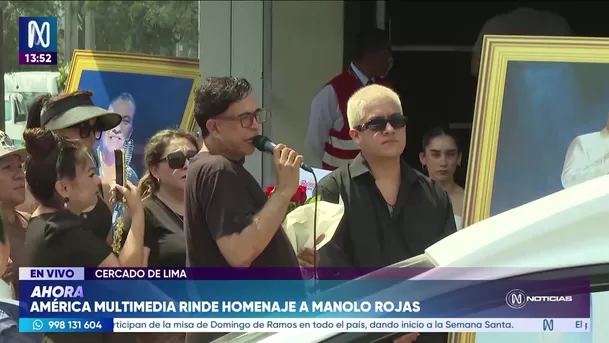 Ernesto Pimentel y el hijo de Manolo Rojas en los exteriores de América Multimedia. Foto: Canal N