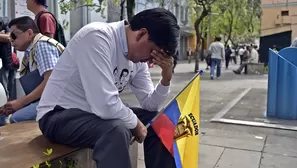 Amigos y familiares de los ecuatorianos asesinados están de luto. Foto: AFP