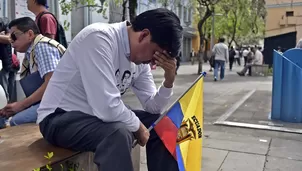 Amigos y familiares de los ecuatorianos asesinados están de luto. Foto: AFP