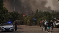 Grecia: Evacúan dos suburbios de Atenas por un fuerte incendio que ha quemado casas. Foto referencial: AFP