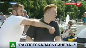 Golpean a reportero ruso. Video: Youtube 'Teezily T-shirts'