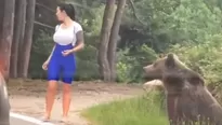 Una joven en Rumania se acerca a oso salvaje para tomarse una foto, pero todo acaba mal. Foto: Captura